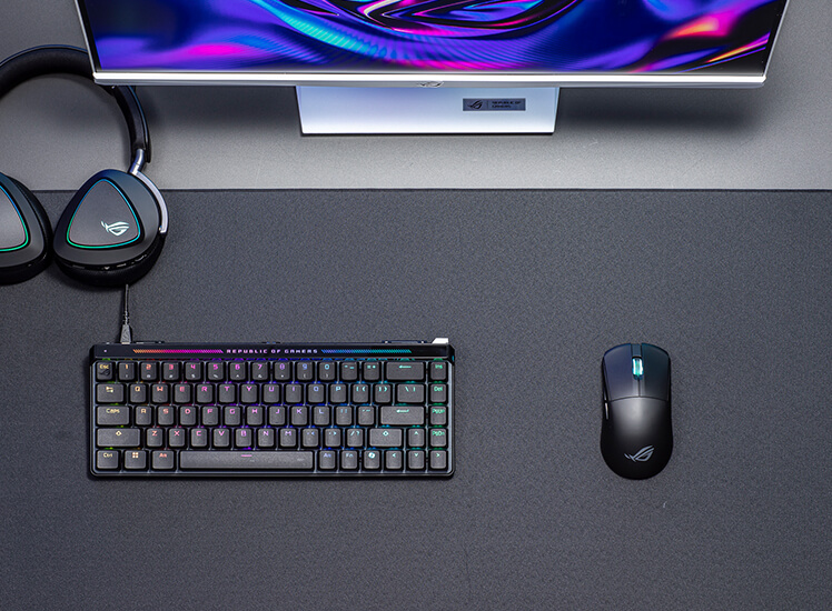 An image showcasing the ROG Harpe Ace Mini and the Falchion Ace HFX within a desktop set up under clean white lighting