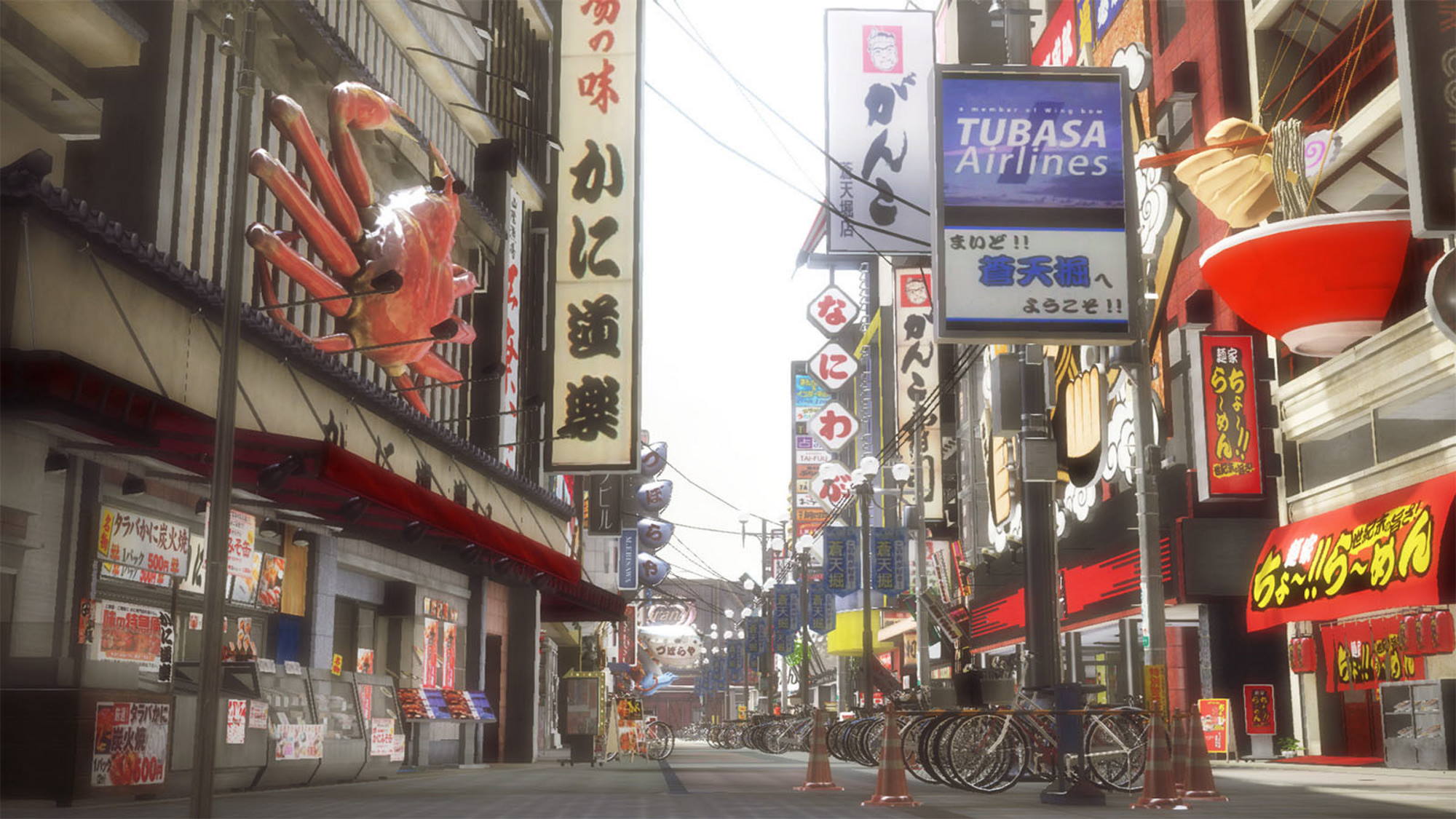 View of an empty street, with signs in Japanese and bicycles parked orderly in the middle of the walkway.