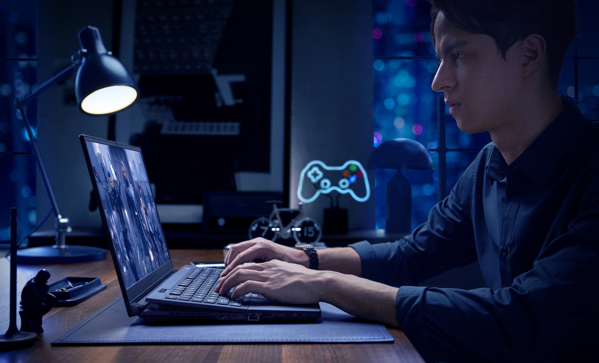 Side view of a gamer using the ROG Zephyrus S17, in a darkened room with gaming decorations.