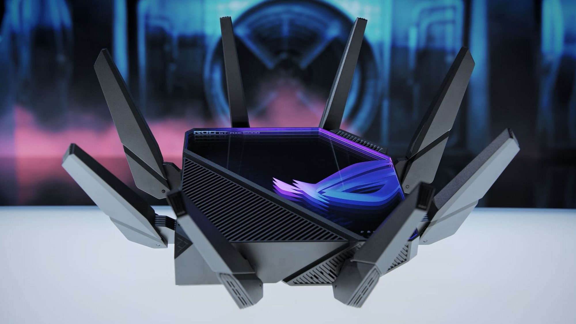 ROG Rapture GT-AXE16000 on a table, with all eight antennae extended.