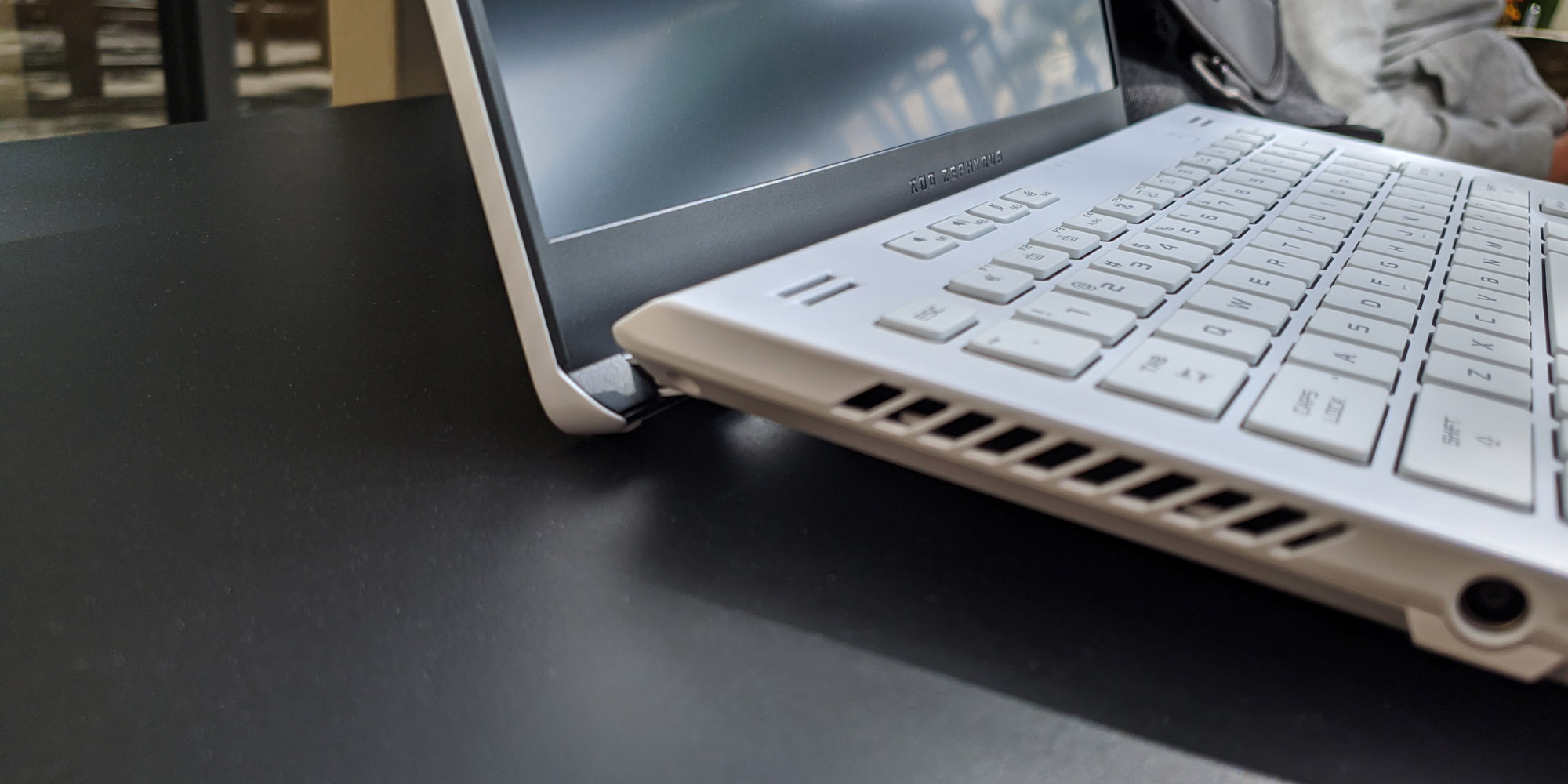A photo of the left side of the Zephyrus G14 laptop, showing the ErgoLift hinge.