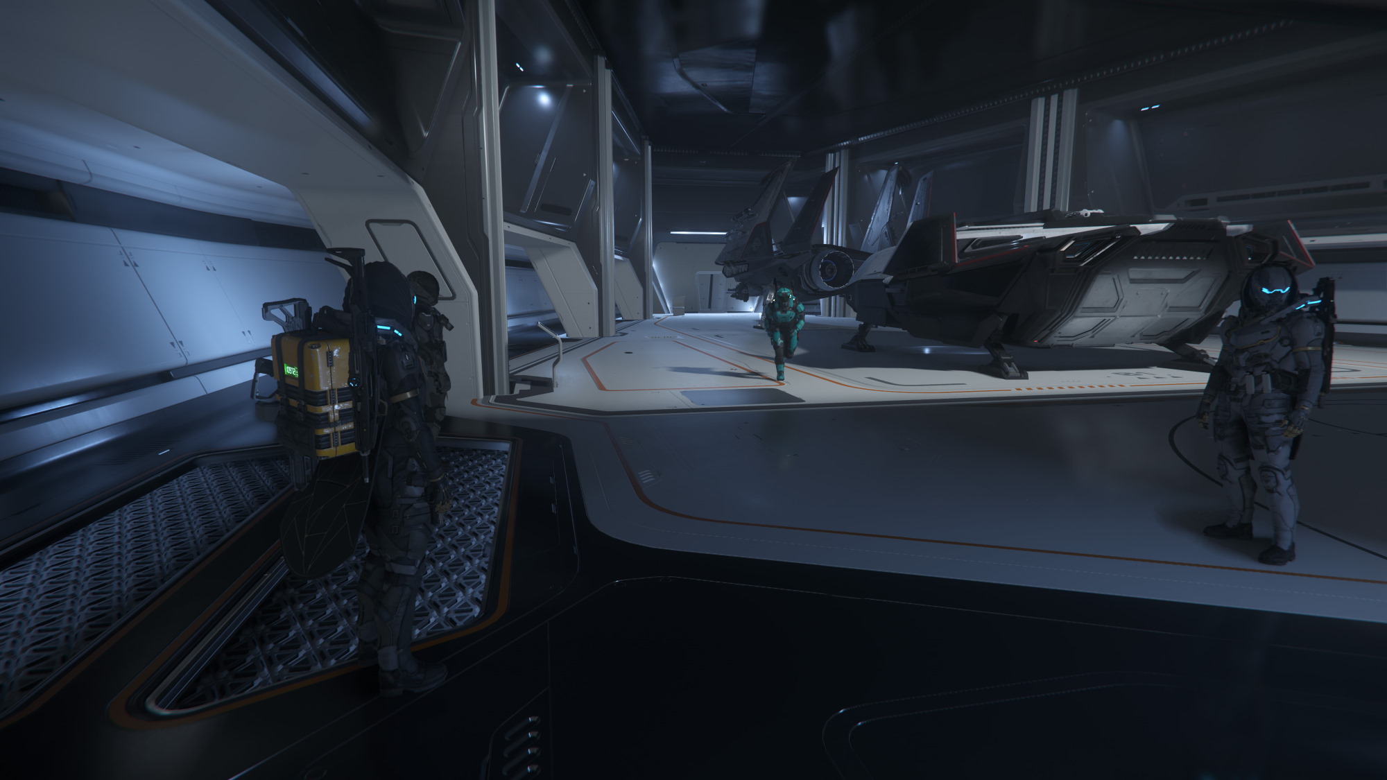 A group of players in the hangar of the 890 Jump, with a Pisces and Arrow landed in the background.