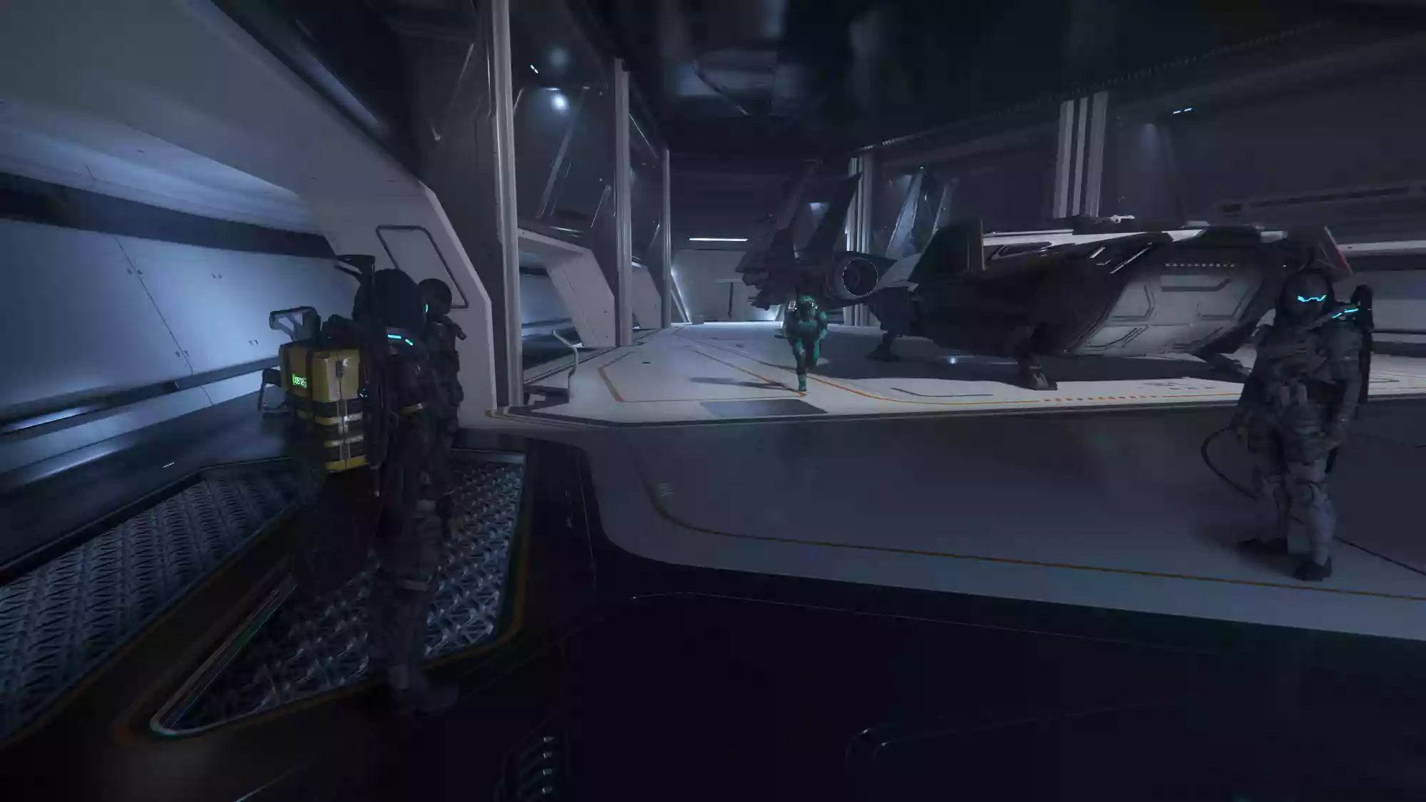 A group of players in the hangar of the 890 Jump, with a Pisces and Arrow landed in the background.