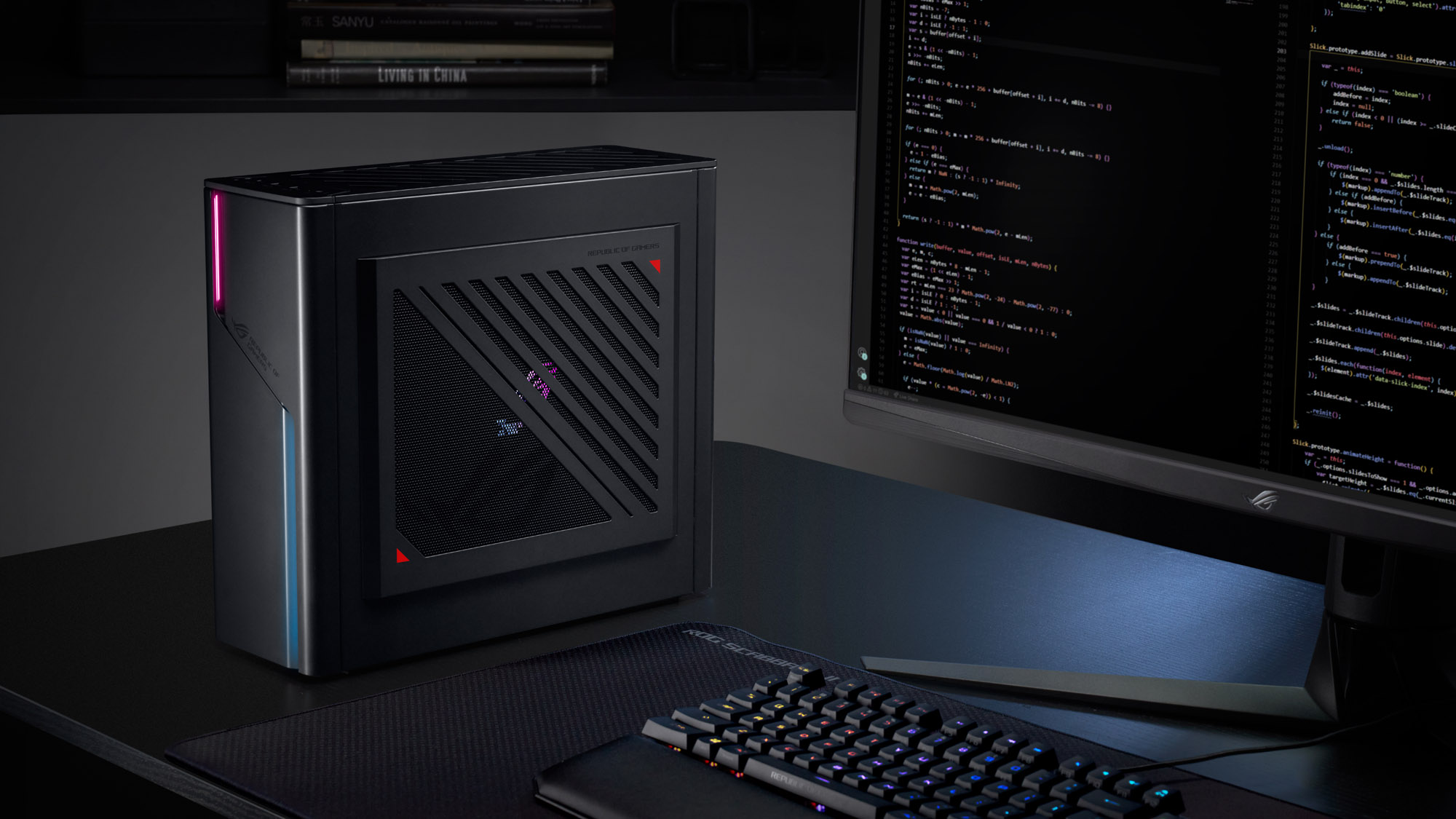 The ROG G22 desktop on a desk next to a gaming monitor and keyboard.