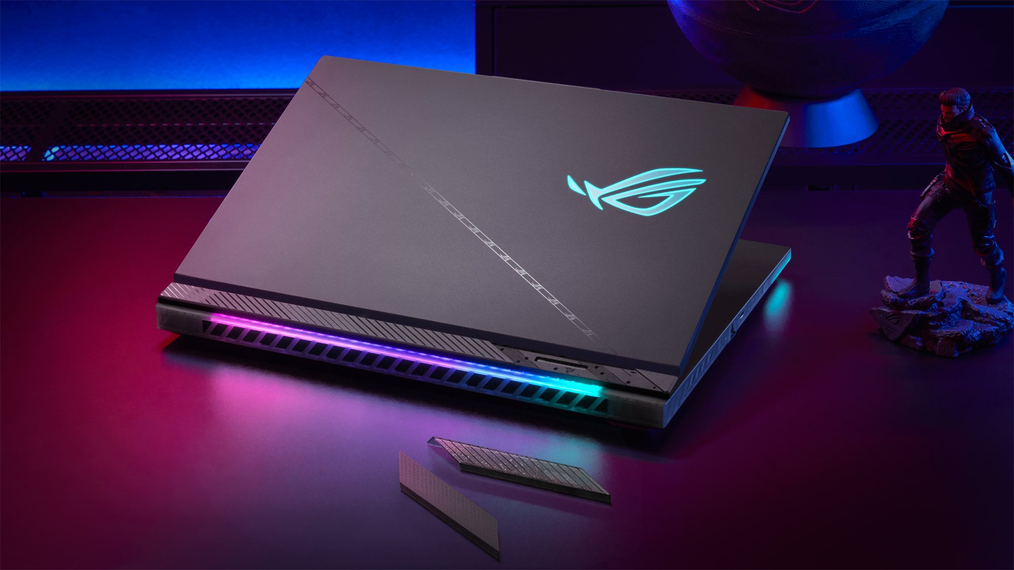 A rear view of the ROG Strix SCAR, mostly closed, with its RGB lighting illuminated.