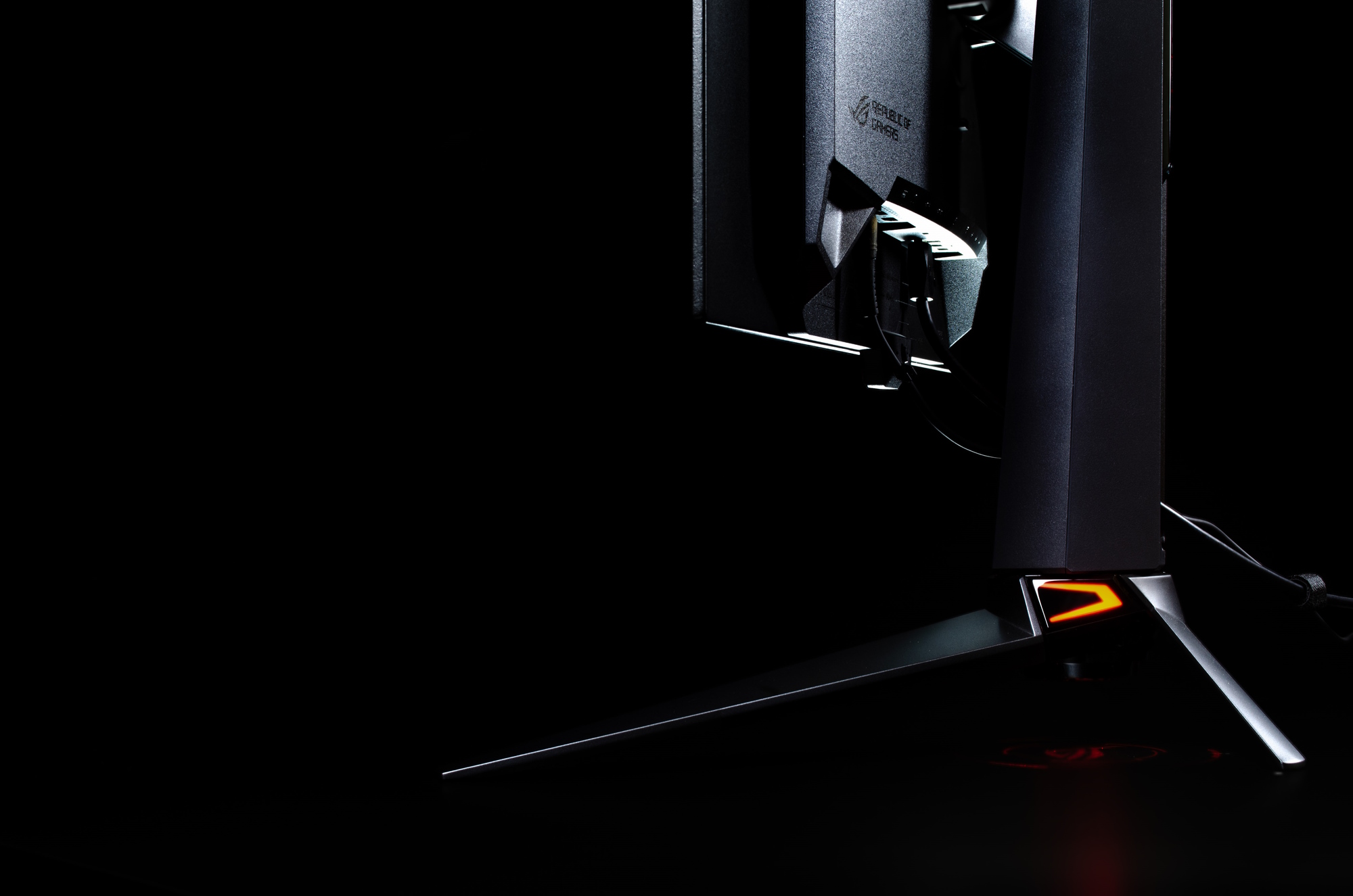 A side view of the PG27AQDM showing the lighting effects on the base