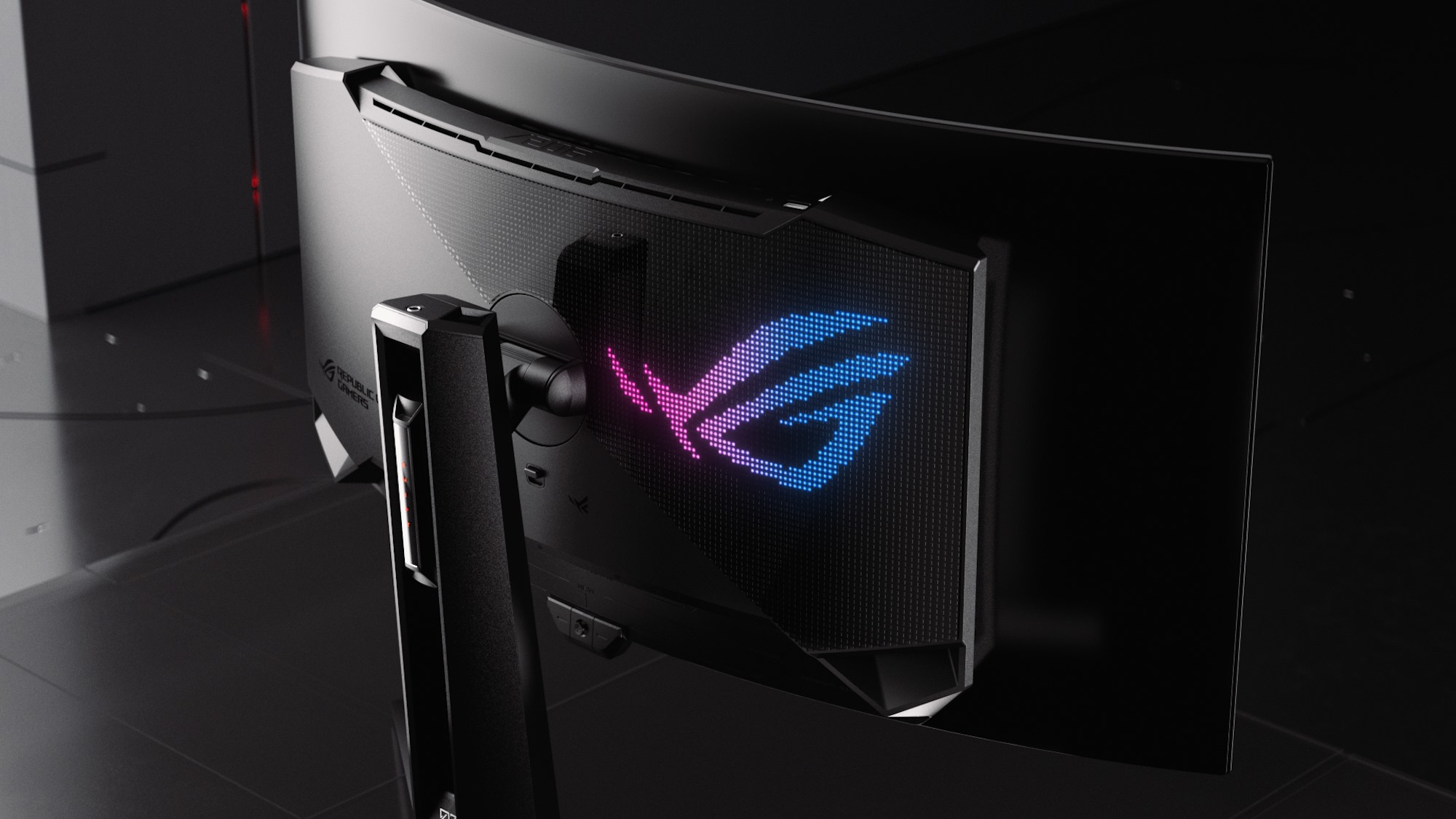 The ROG Swift OLED PG34WCDM gaming monitor from a rear-facing view that shows the Aura Sync RGB LED logo