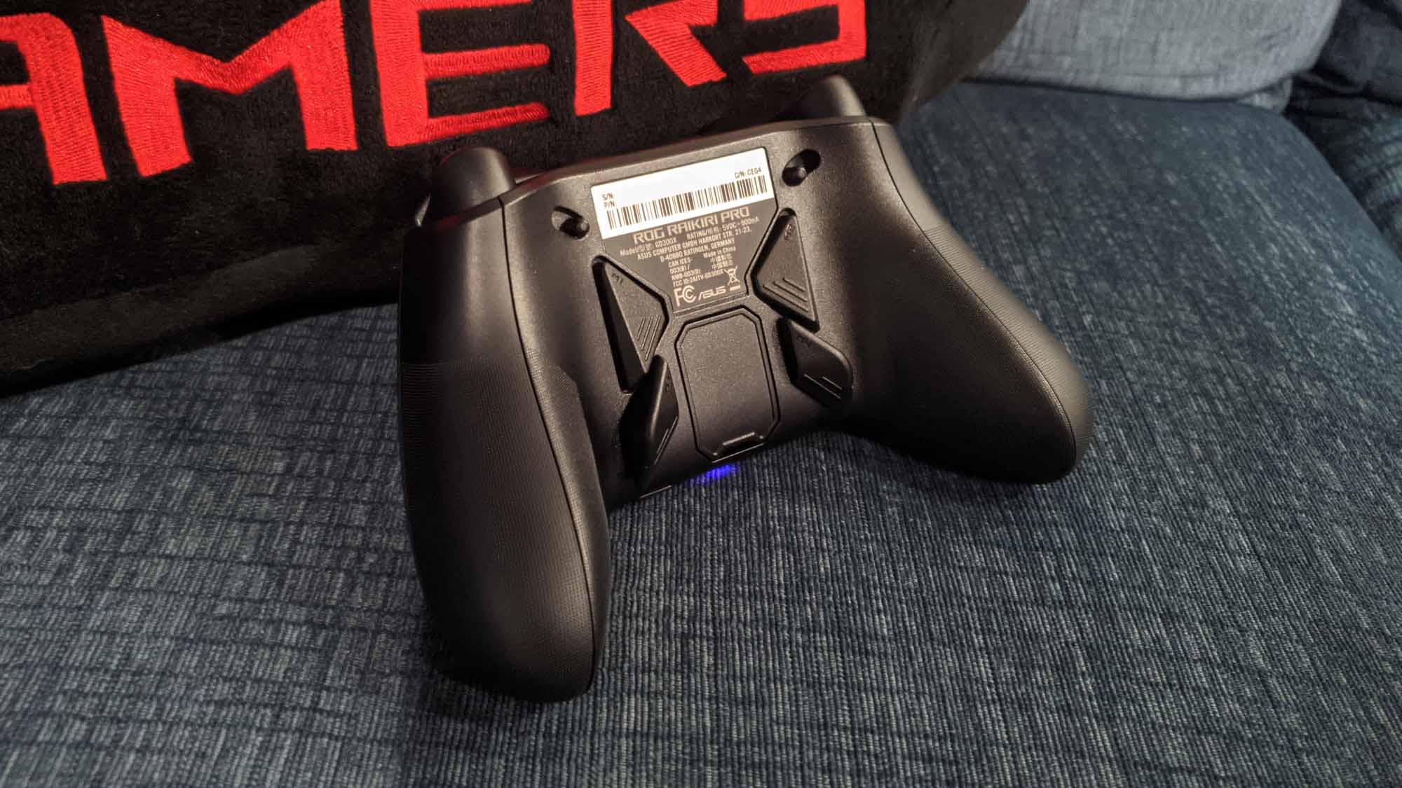 Rear view of the ROG Raikiri Pro controller on a couch.