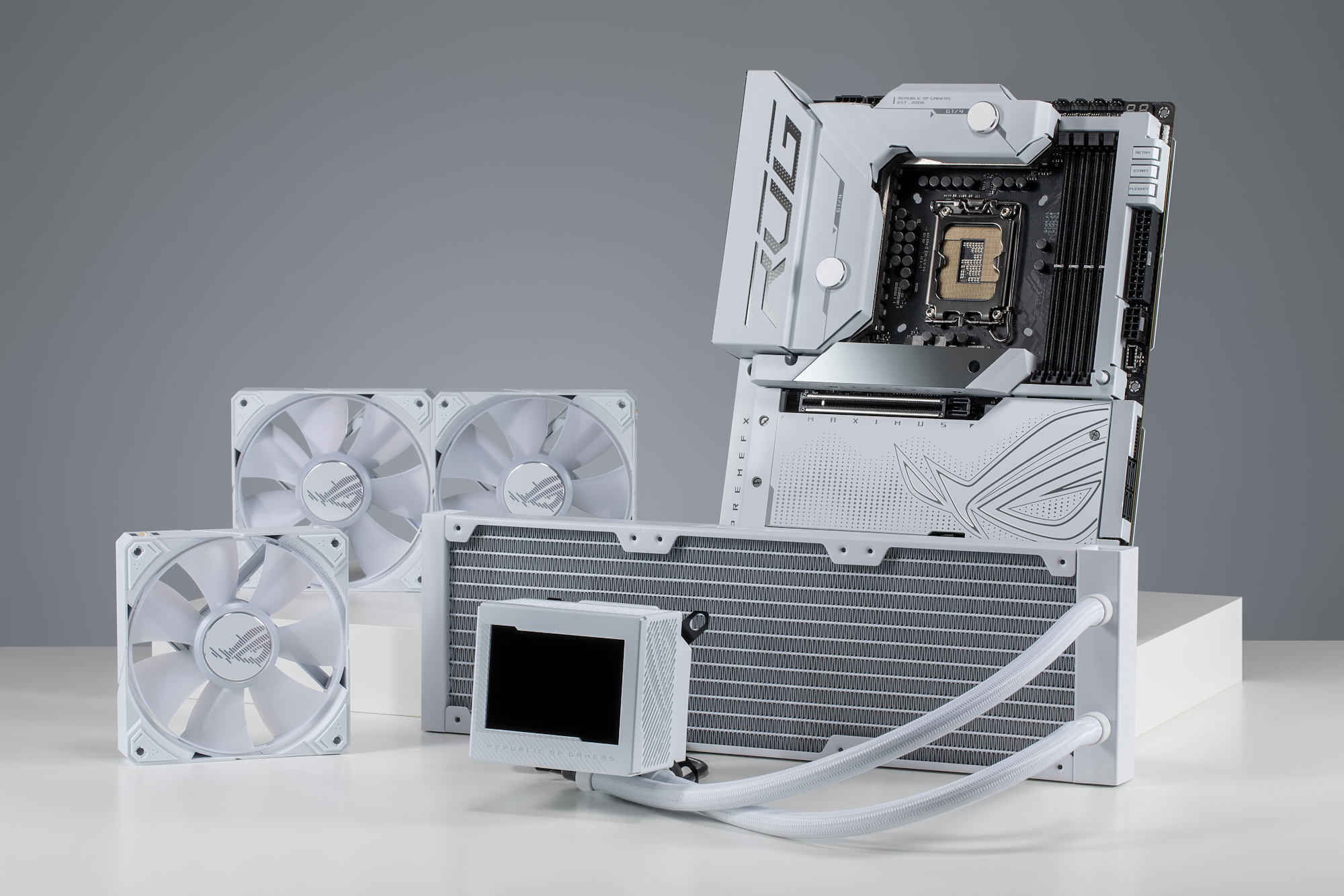 The ROG Maximus Z790 Formula motherboard and ROG Ryujin III AIO White Edition AIO liquid cooler arranged on a table