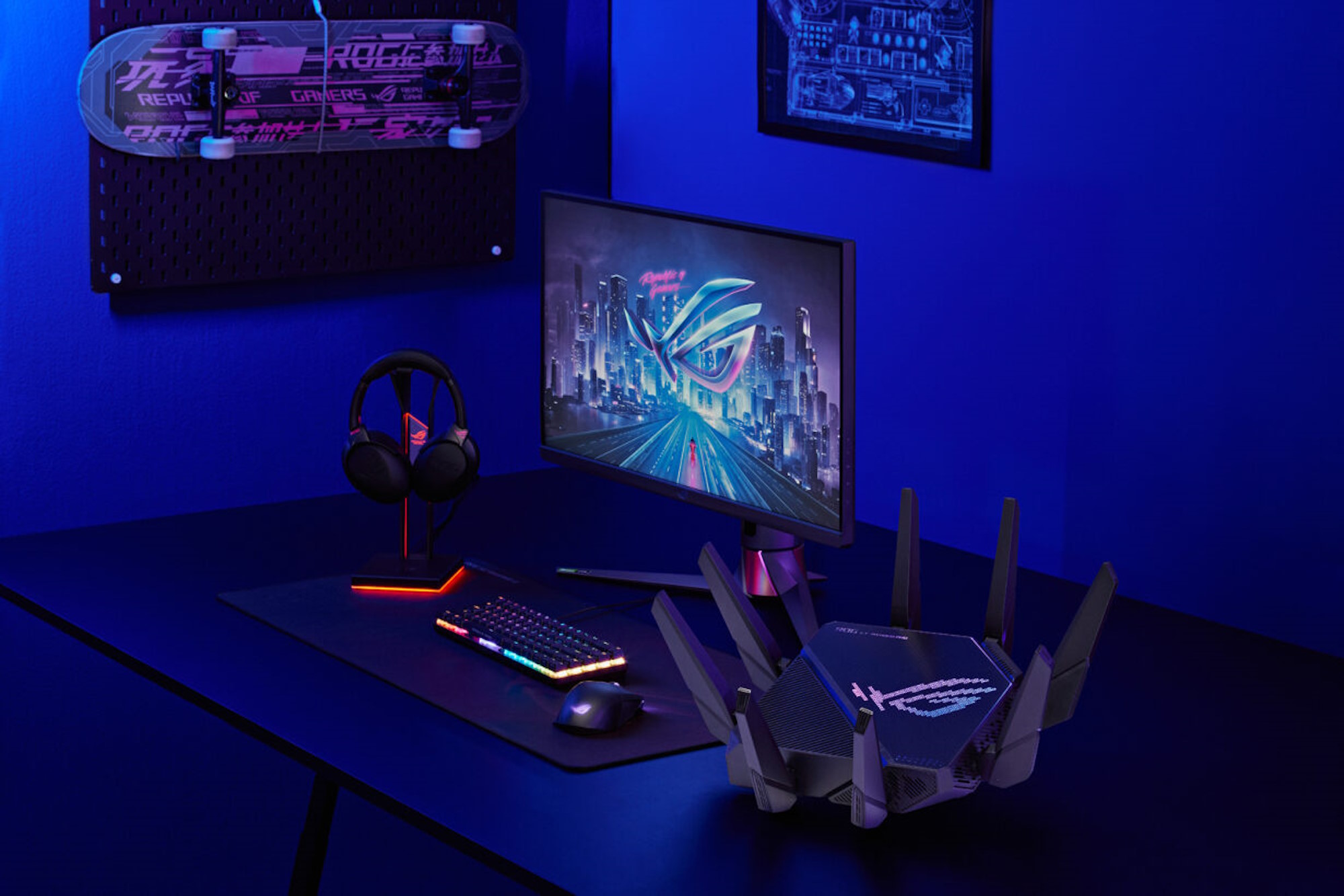 The ROG Rapture GT-AXE16000 wireless router on a table with other ROG gaming gear