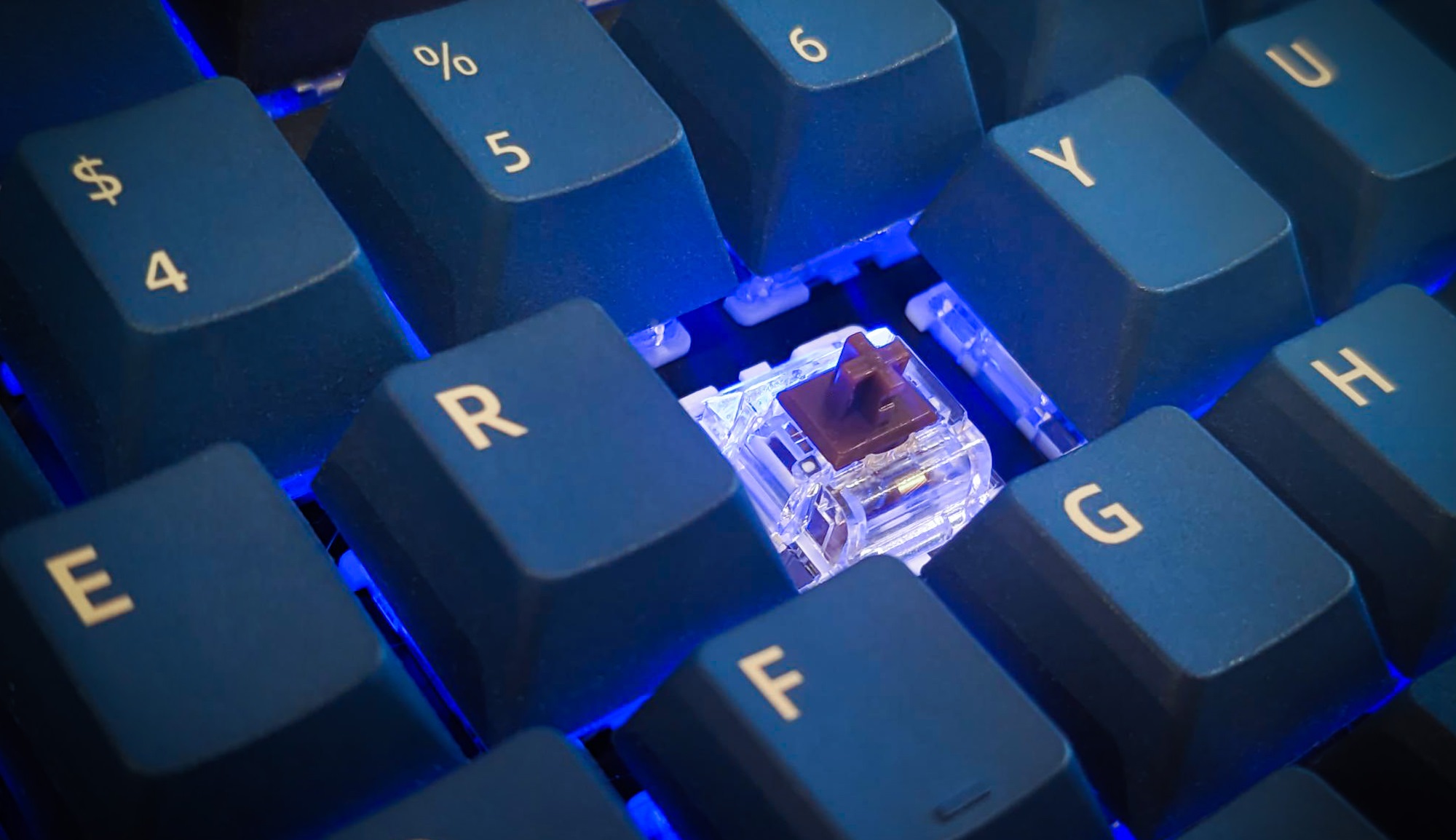 a closeup view of the ROG Azoth keyboard with the T switch removed