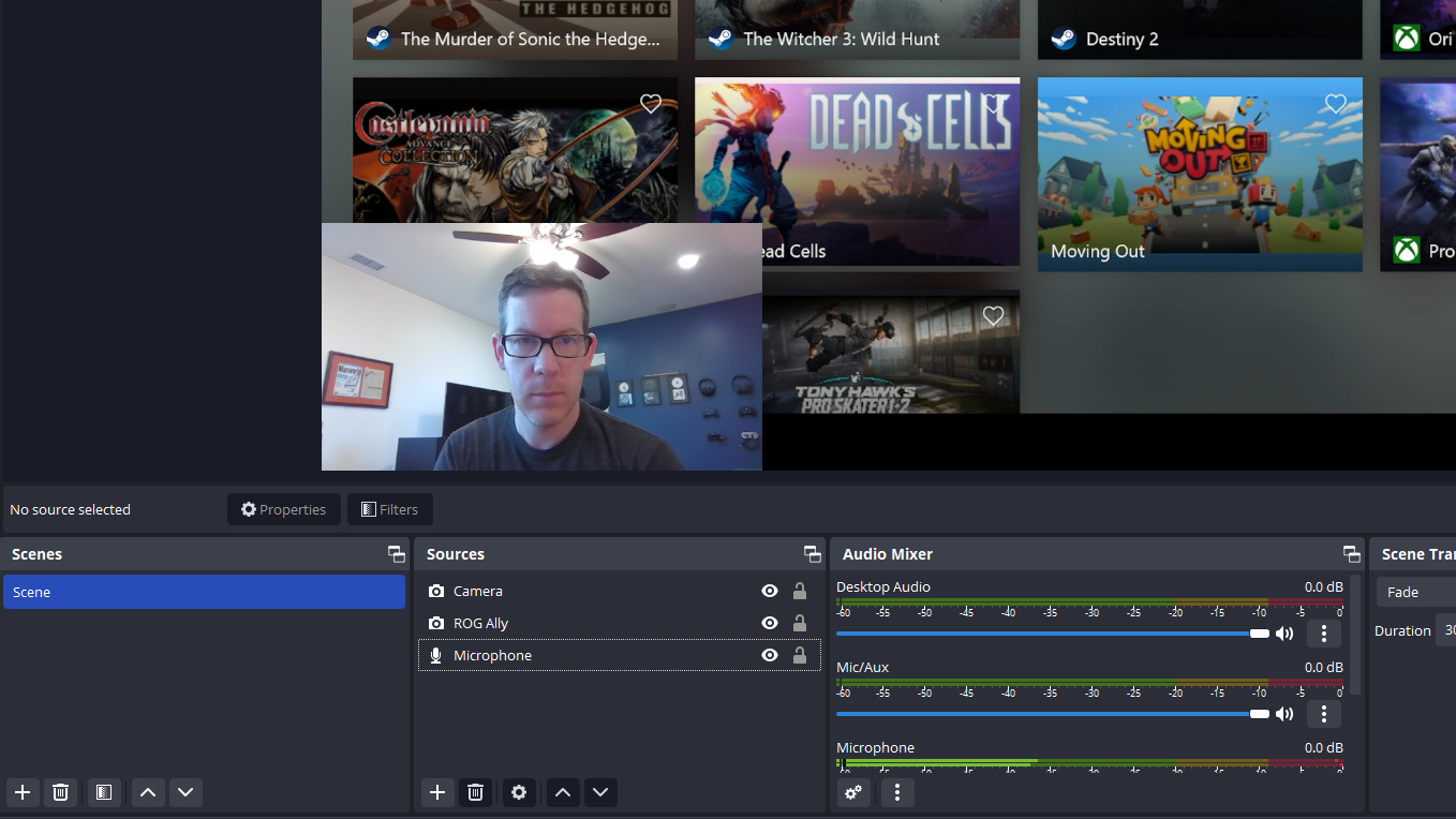 The main OBS Studio window with a computer and face camera visible in the scene.