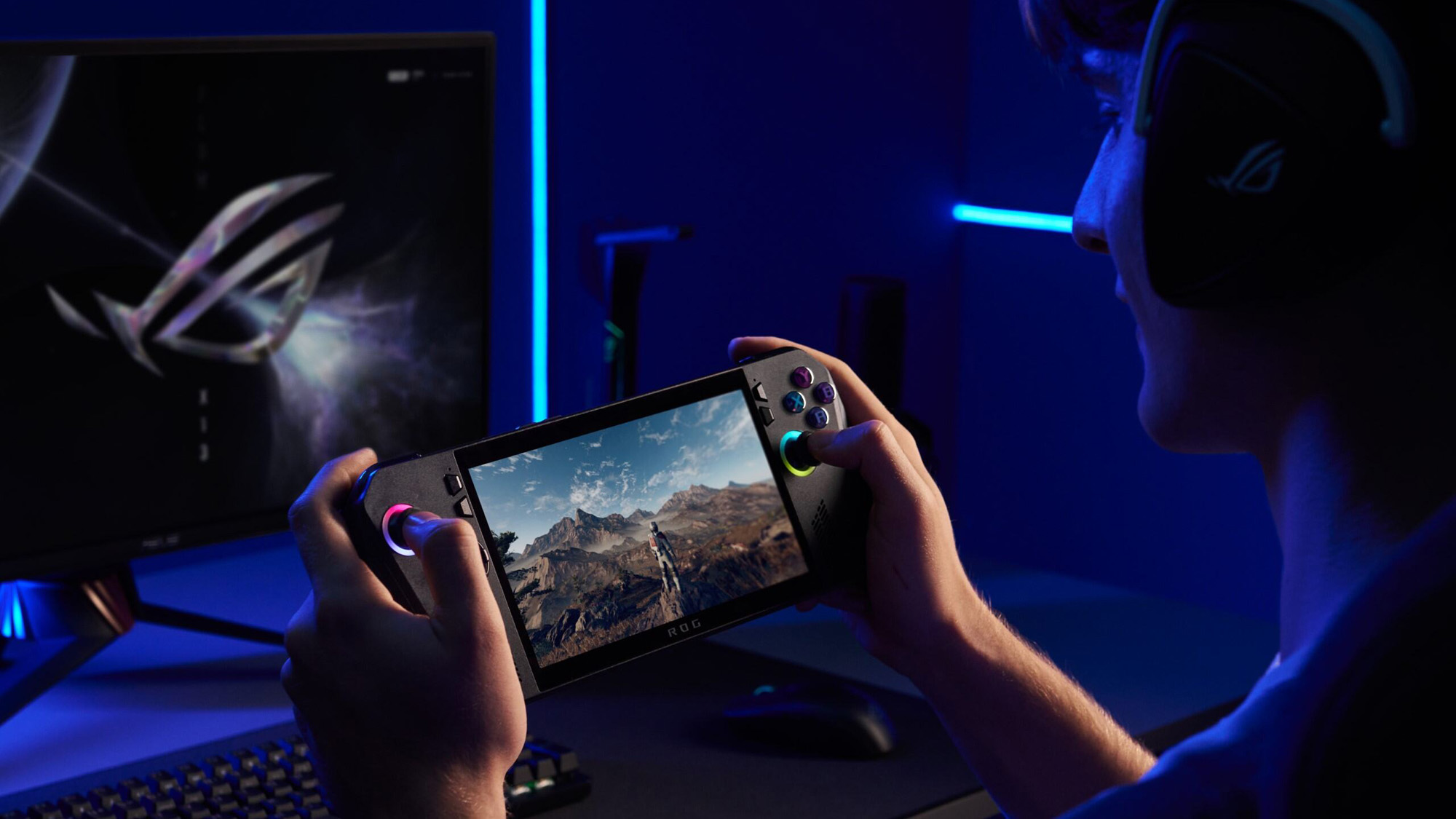 Two hands holding an ROG Ally X in a dark room.