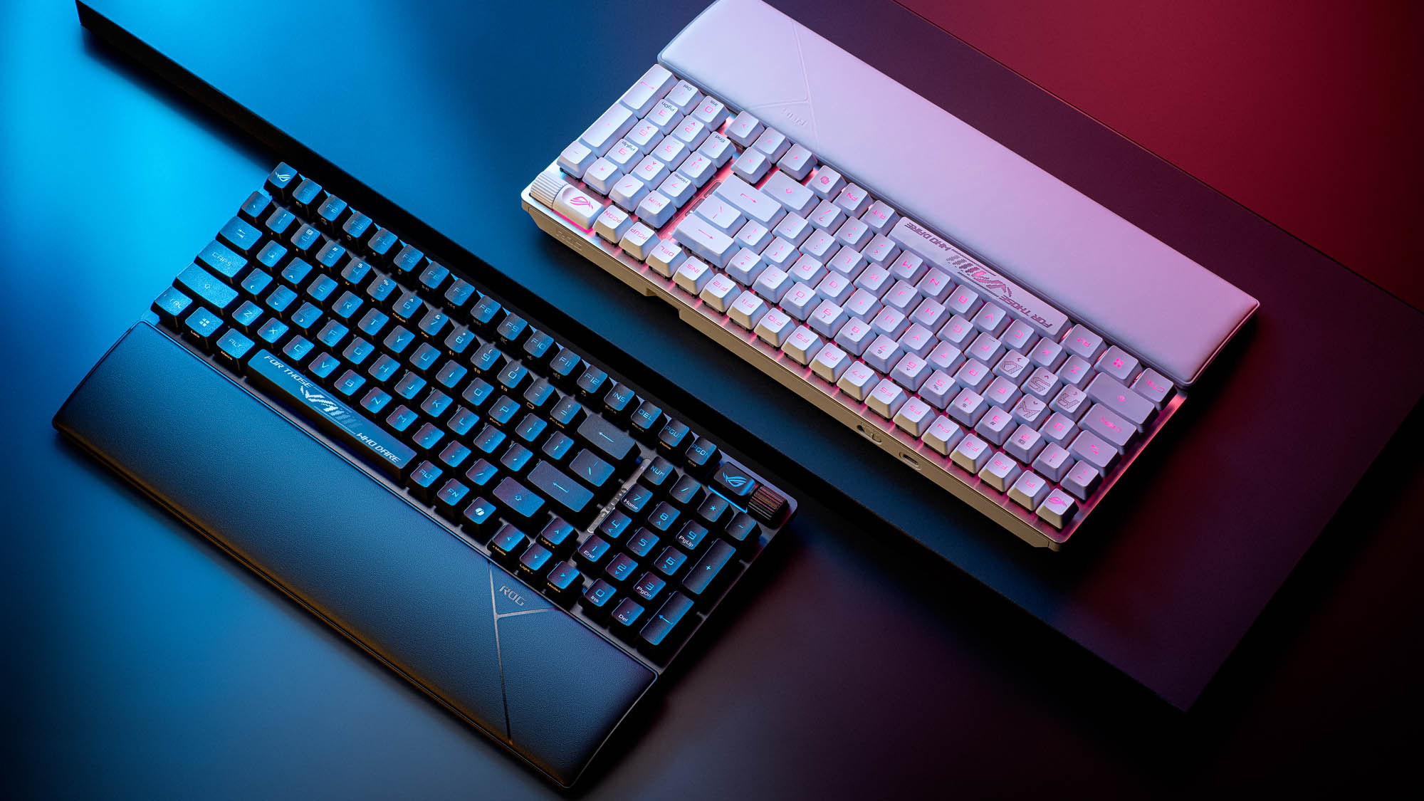 Two ROG Strix Scope II 96 RX Wireless keyboards, one in white and one in black.