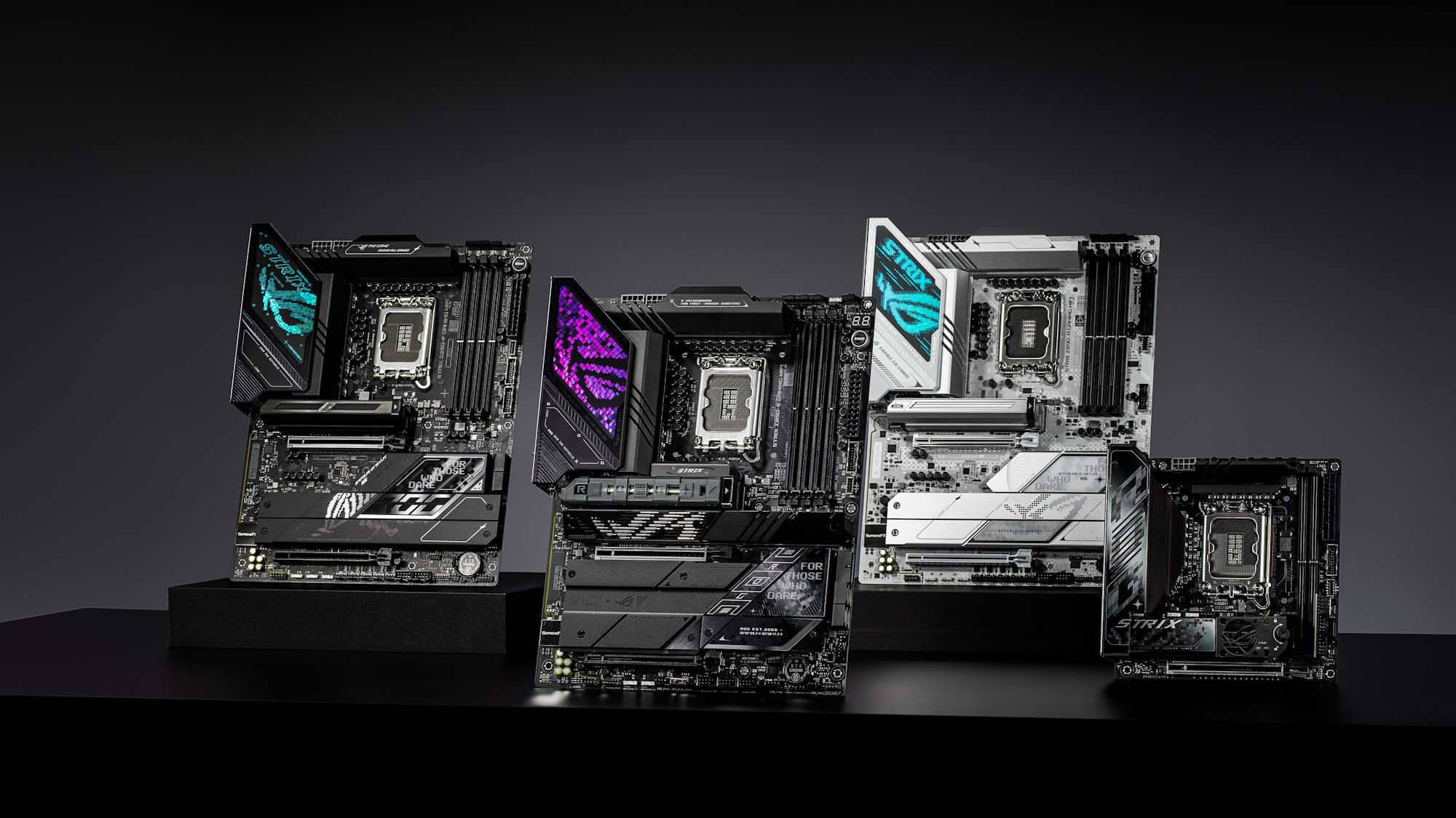 Four ROG Z890 motherboards in a row on a table