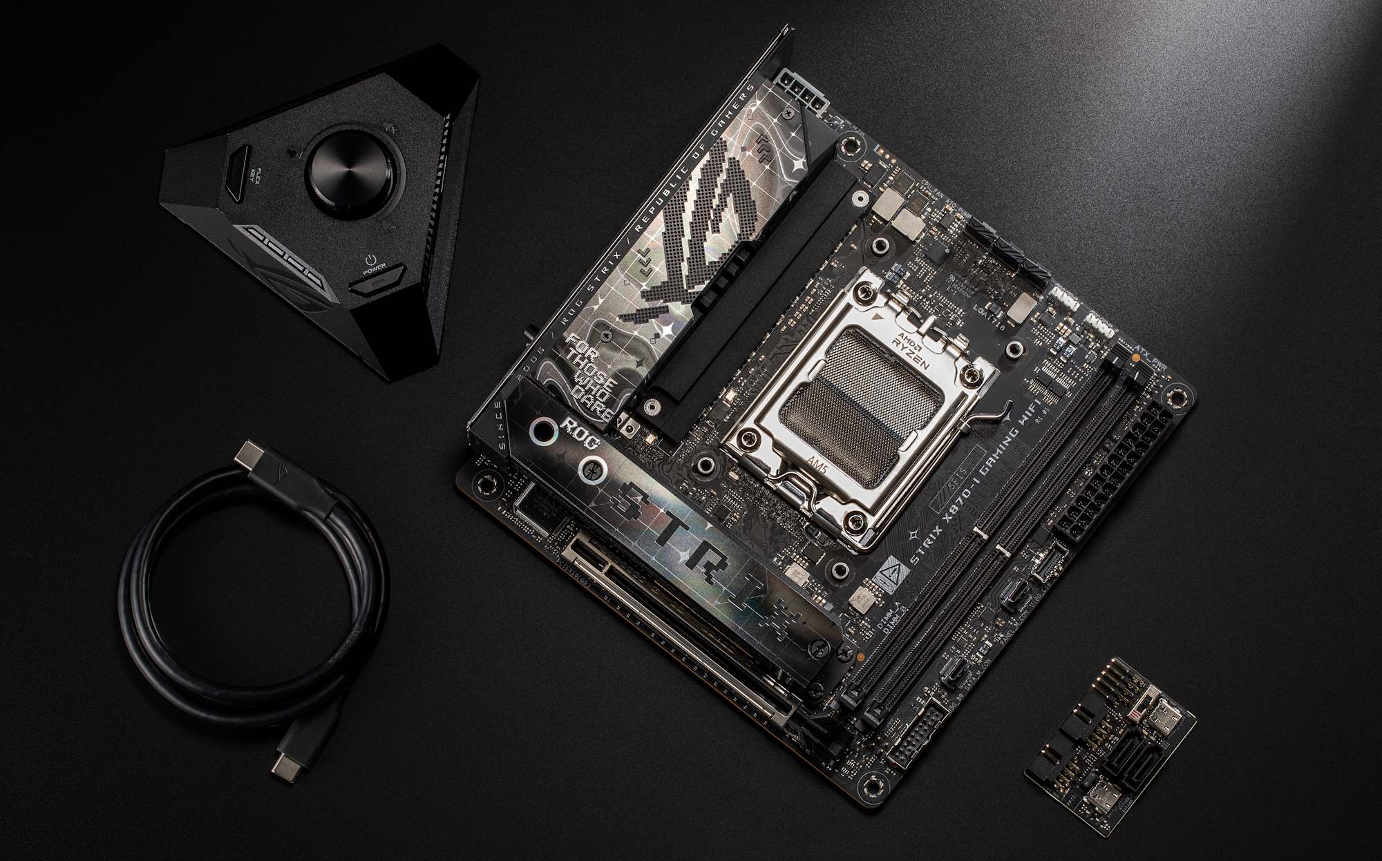 The ROG Strix Z890-I Gaming WiFi motherboard from an overhead view with its accessories arranged nearby