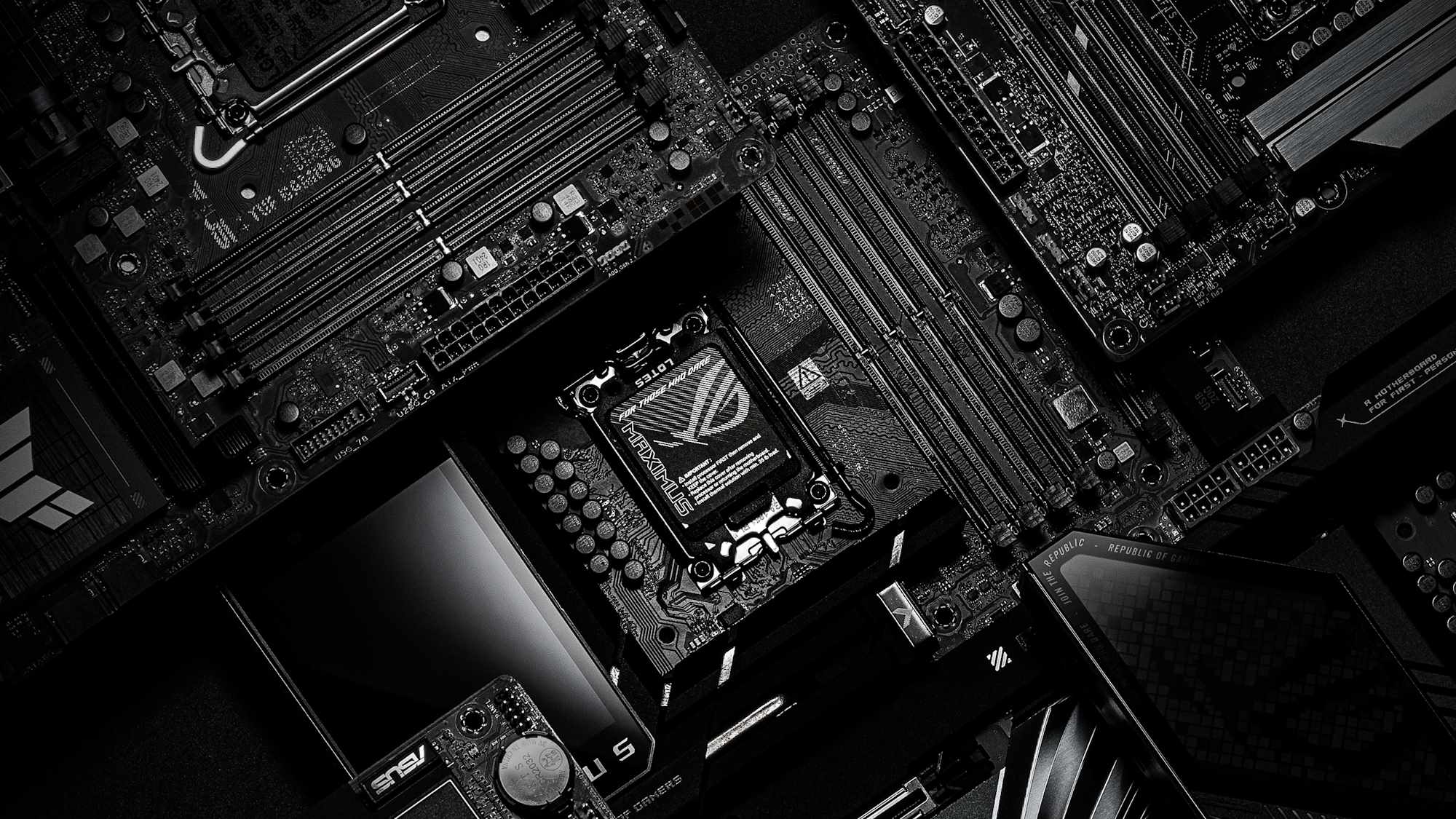 A closeup view of several ASUS Z890 motherboard piled up on top of each other