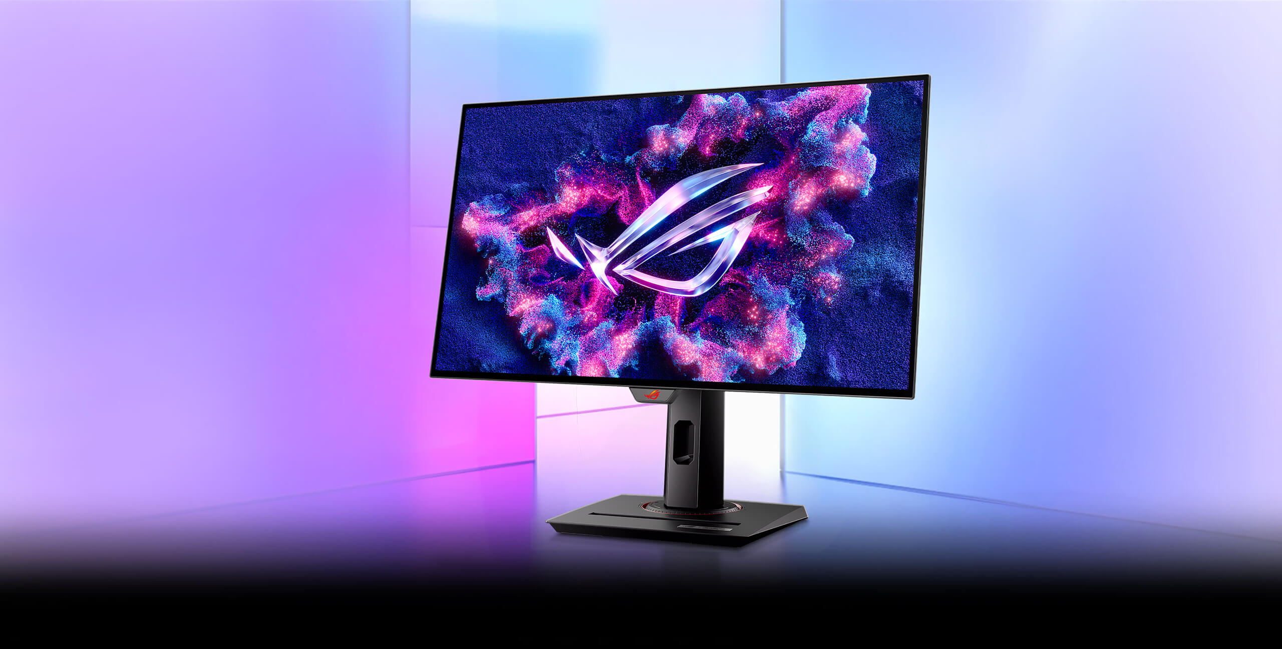 Ein ROG Strix OLED XG27AQDMG vor farbigem Hintergrund