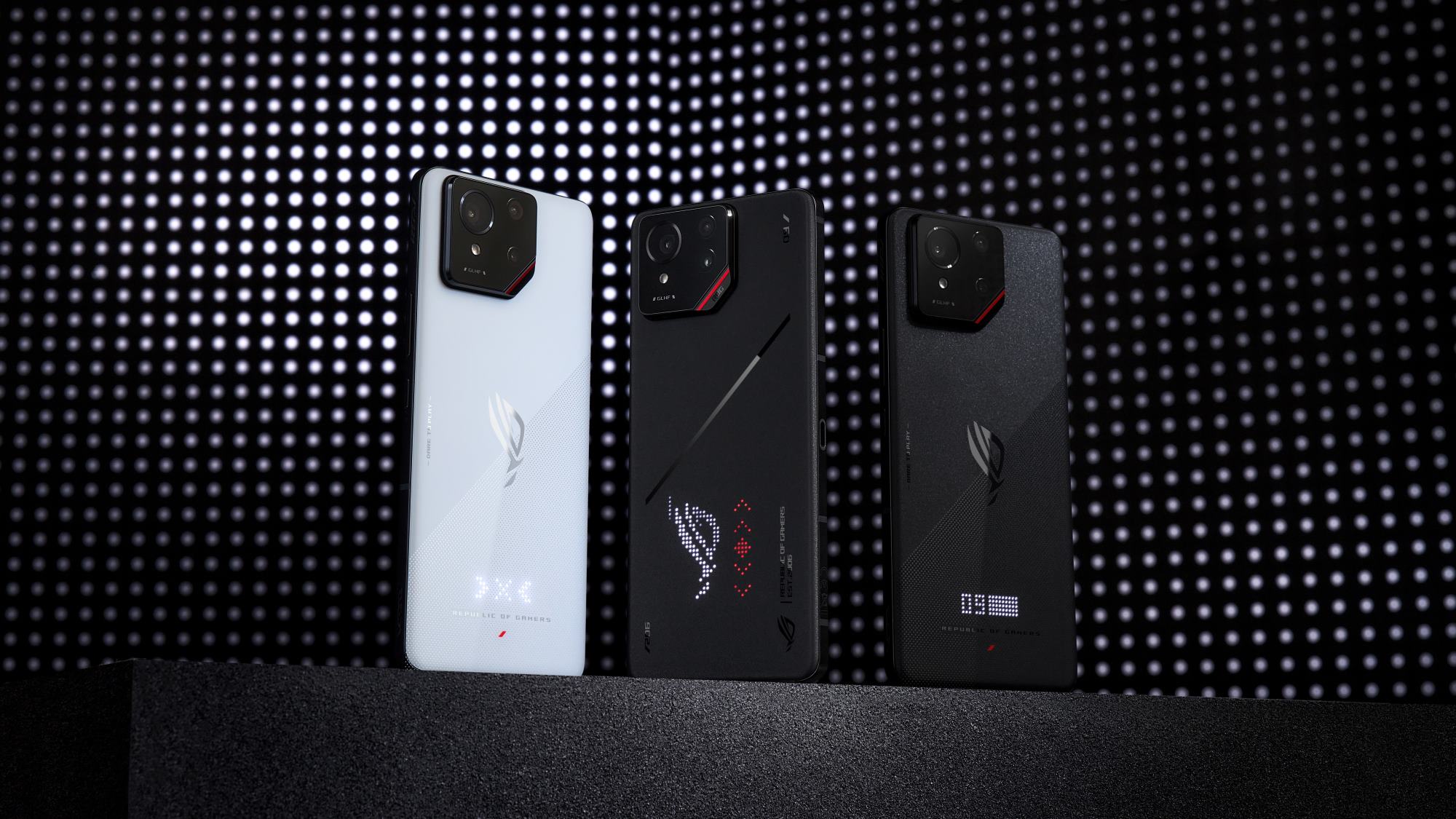 The three ROG Phone 9 models standing side-by-side against a black and white backdrop.