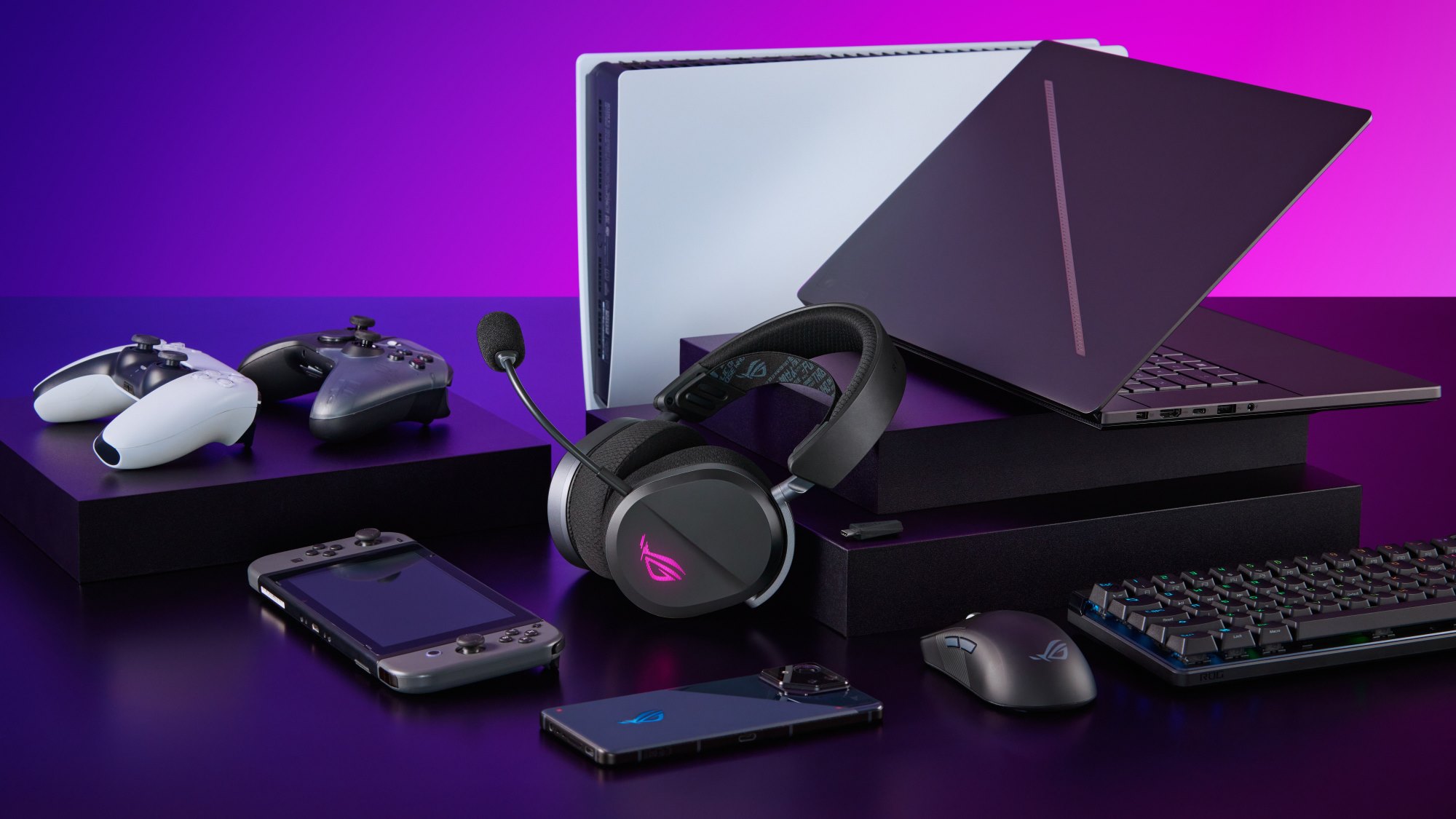 The ROG Pelta gaming headset surrounded by game consoles, laptops, and phones, set against a purple backdrop.