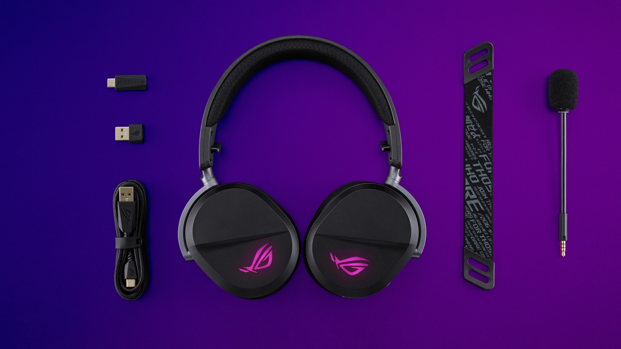 The ROG Pelta gaming headset displayed against a purple backdrop with its accessories, including a USB-C dongle and microphone.