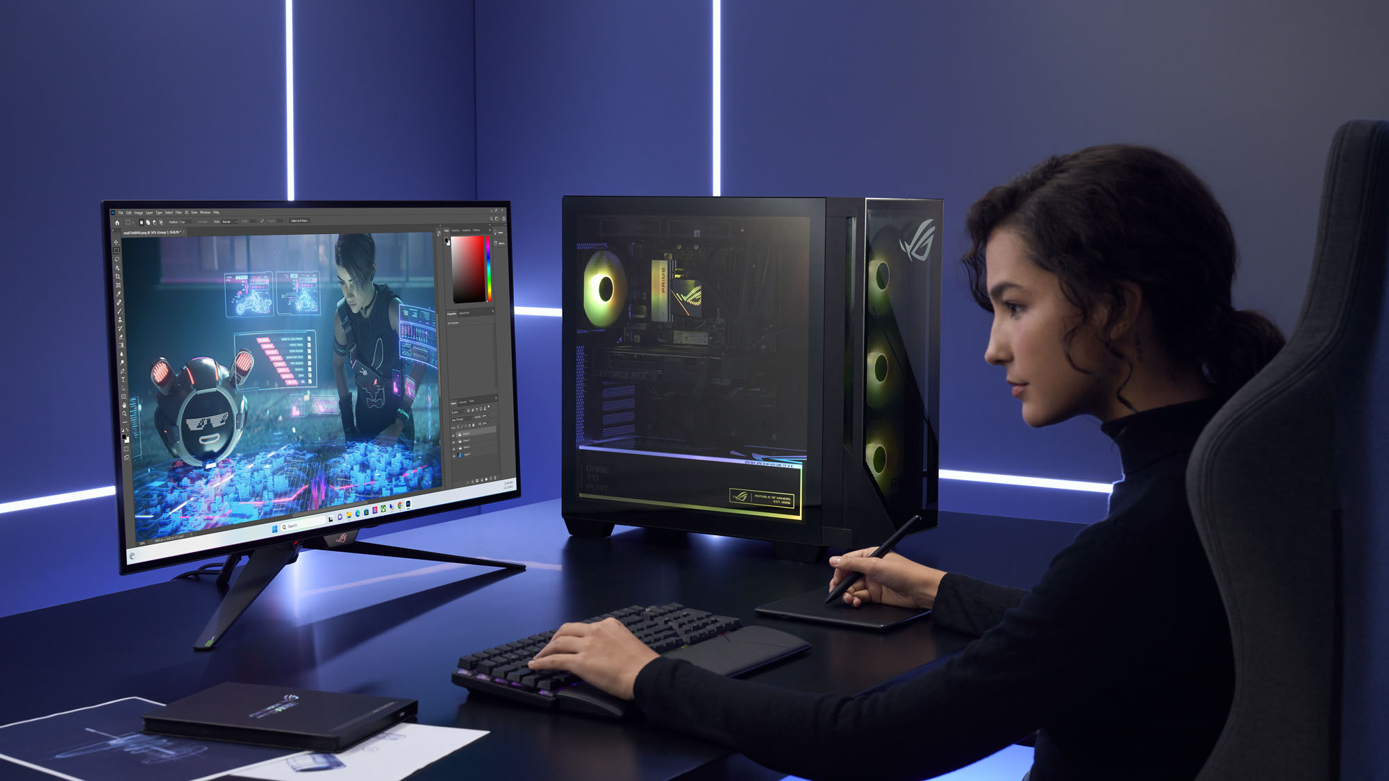 A woman editing an image on the ROG G700 gaming desktop, sitting on a desk next to him.