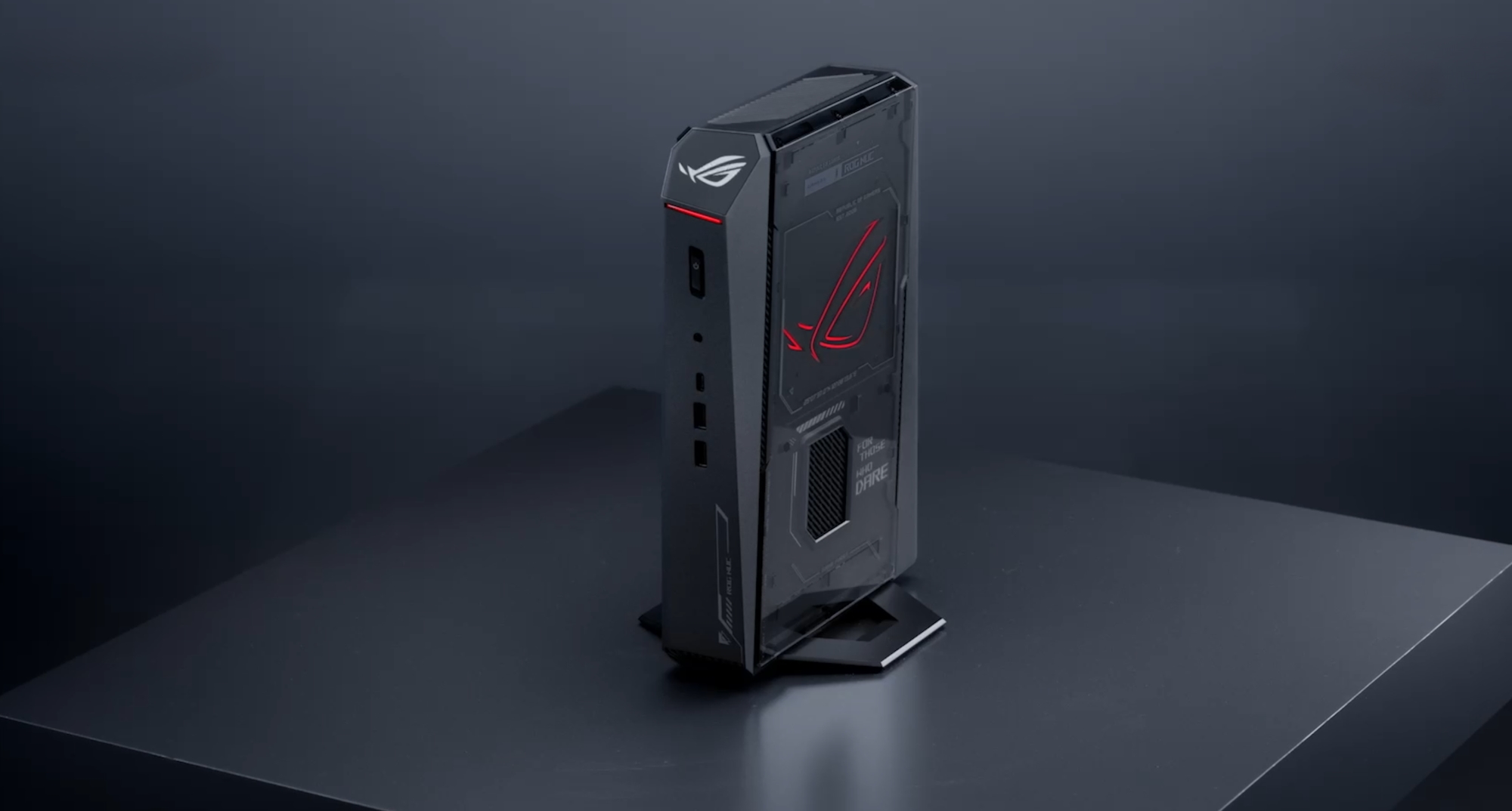 The ROG NUC on a black table.