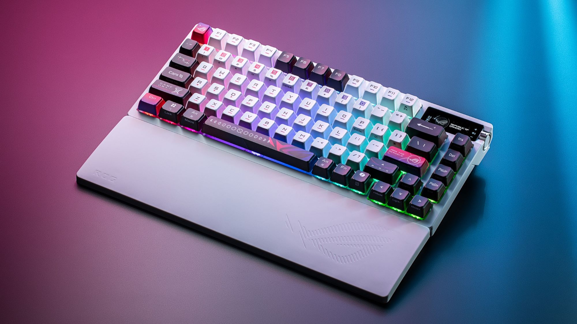 The ROG Azoth X keyboard and wrist rest against a red and blue gradiant background.