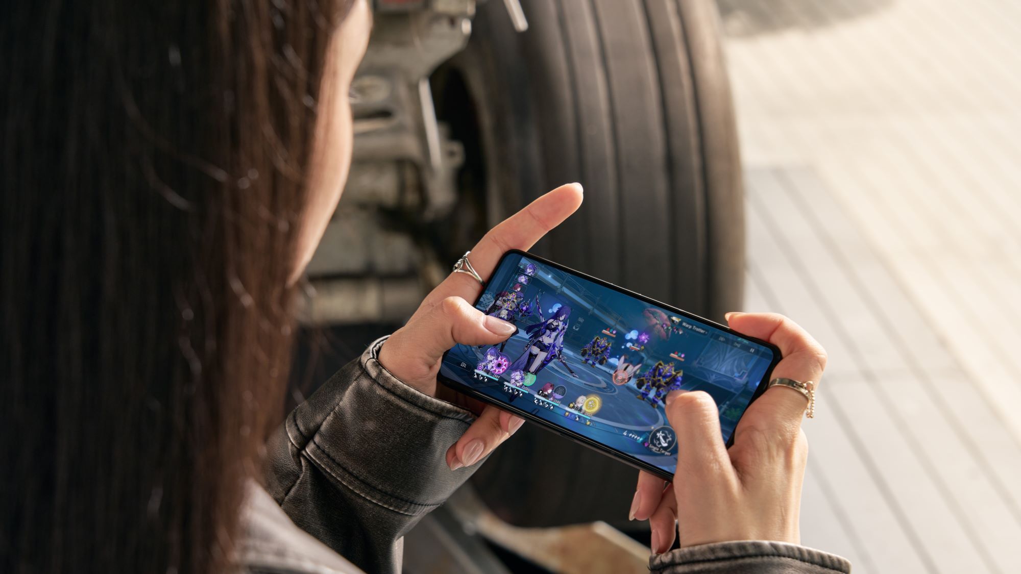 A woman playing Honkai Star Rail on ROG Phone 9