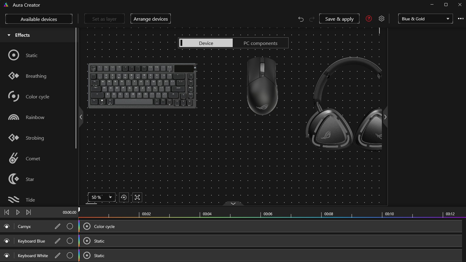 A screenshot of the Aura Creator window with a keyboard, mouse, and headset visible