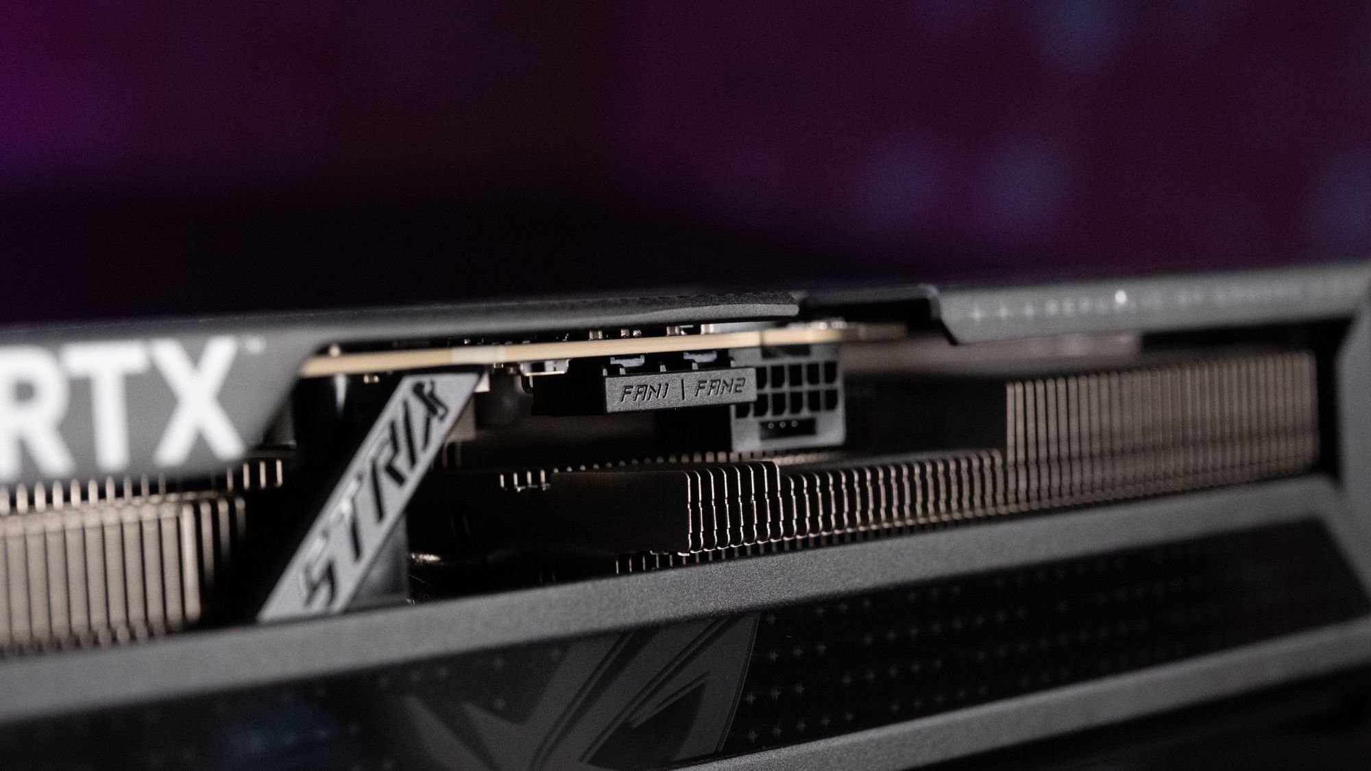 A side view of the ROG Strix GeForce RTX 5070 Ti with the heatsink fins visible