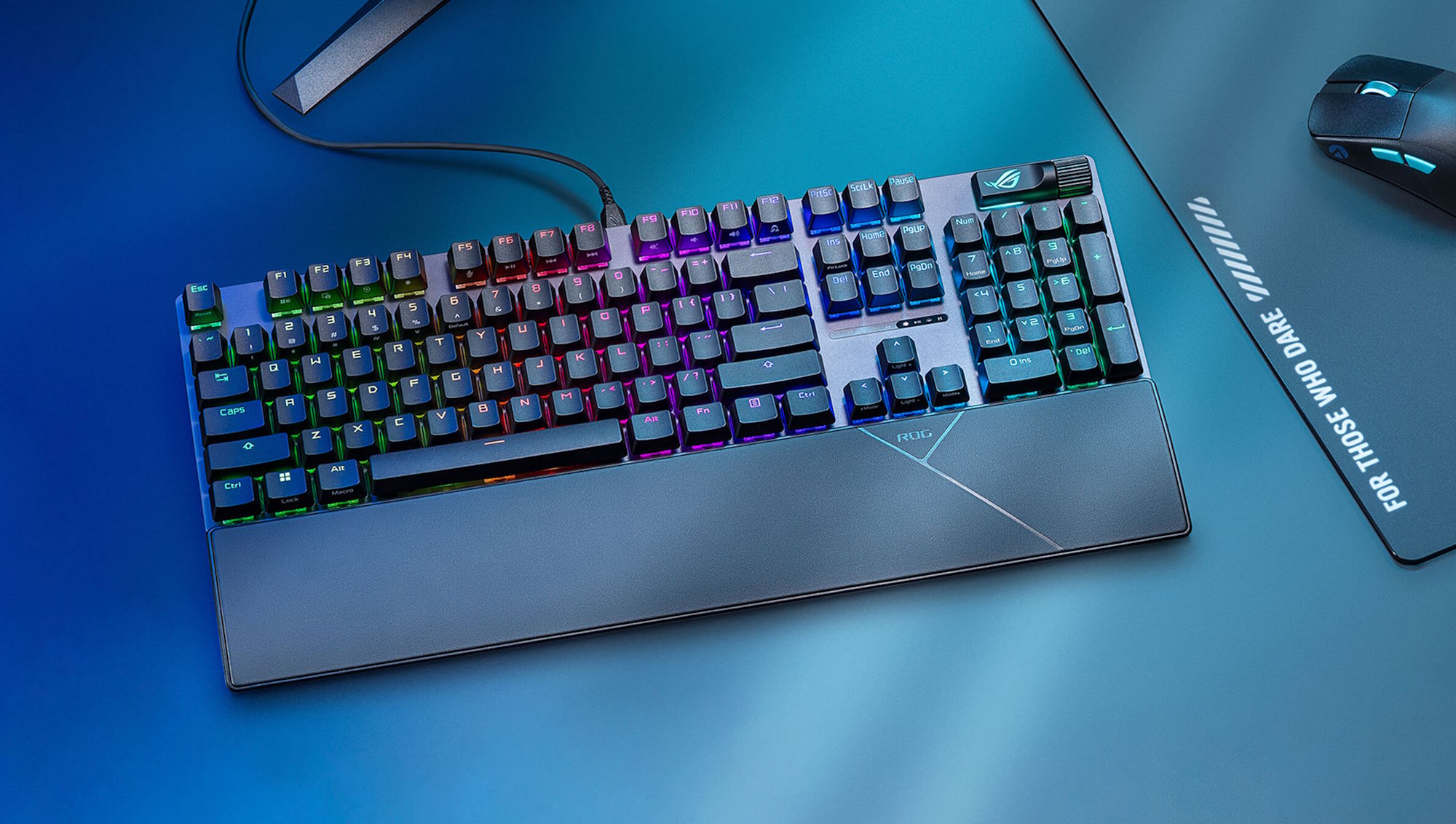 The ROG Strix Scope II X keyboard on a desk with other ROG peripherals