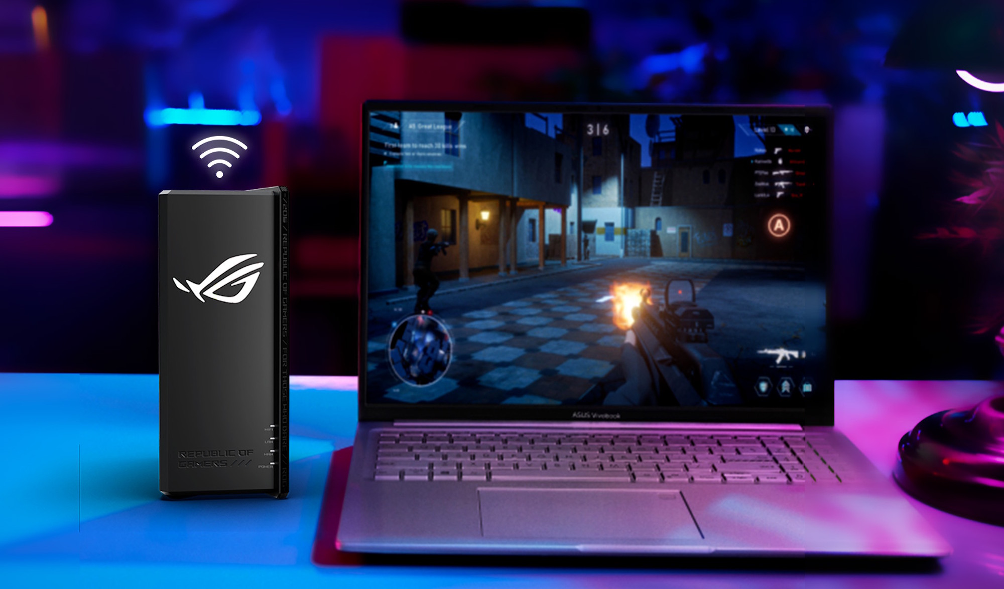 the rog strix gs-be18000 router on a desk next an ROG laptop in a room full of gaming gear