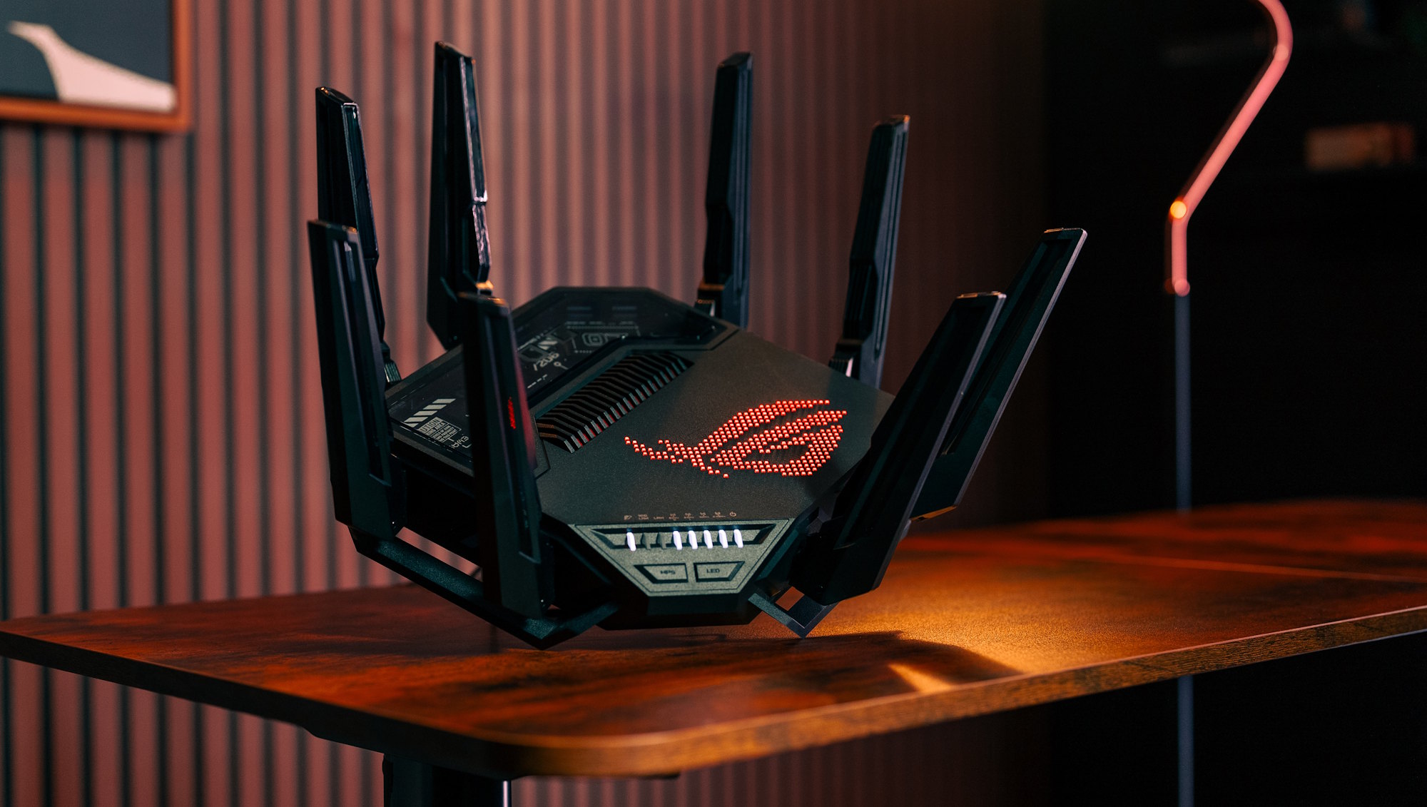 a view of the ROG Rapture GT-BE98 Router as it sits on an end table in a daming den