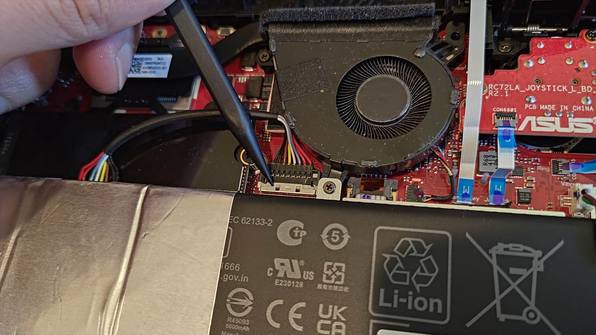 The inside of the ROG Ally X, with the battery connector highlighted