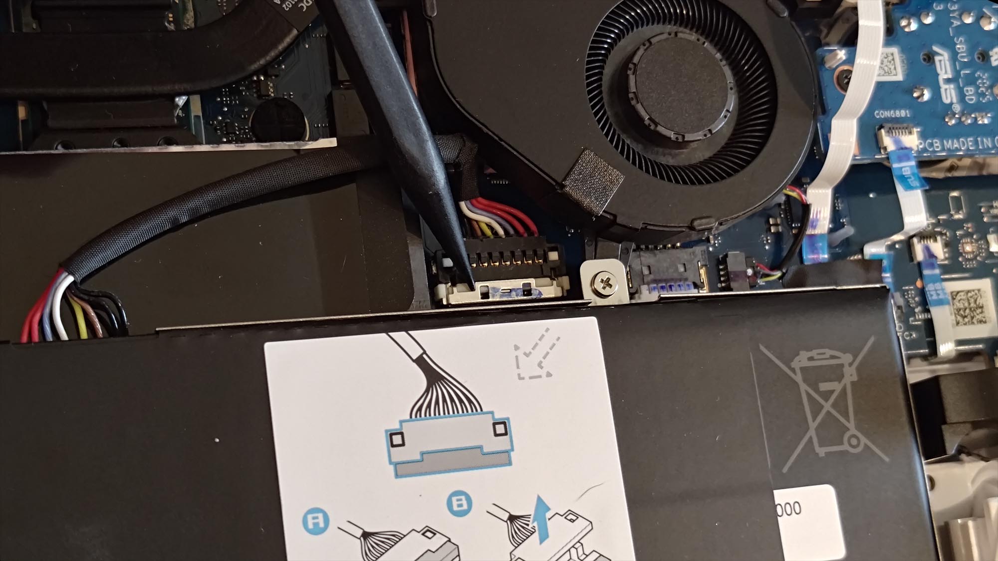 The inside of the ROG Xbox Ally, with the battery connector highlighted