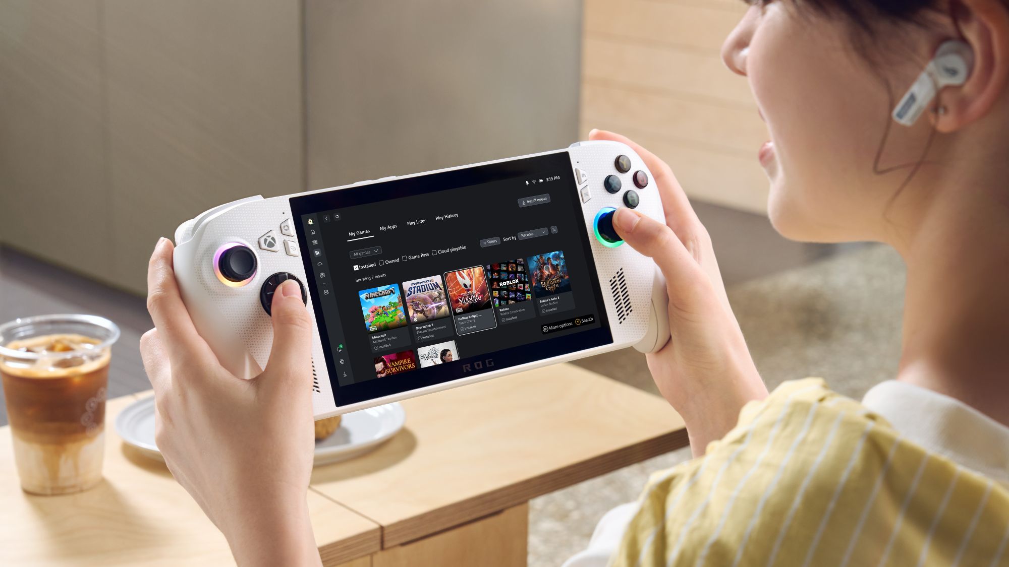 A woman browses Game Pass on her ROG Xbox Ally