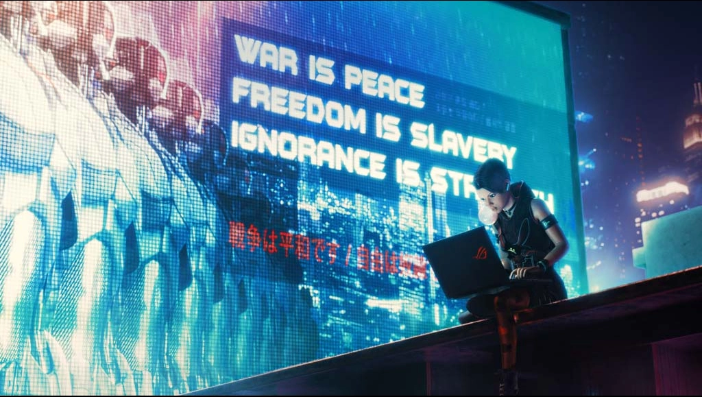 Image of AchT sitting on the edge of the building and using her ROG laptop.